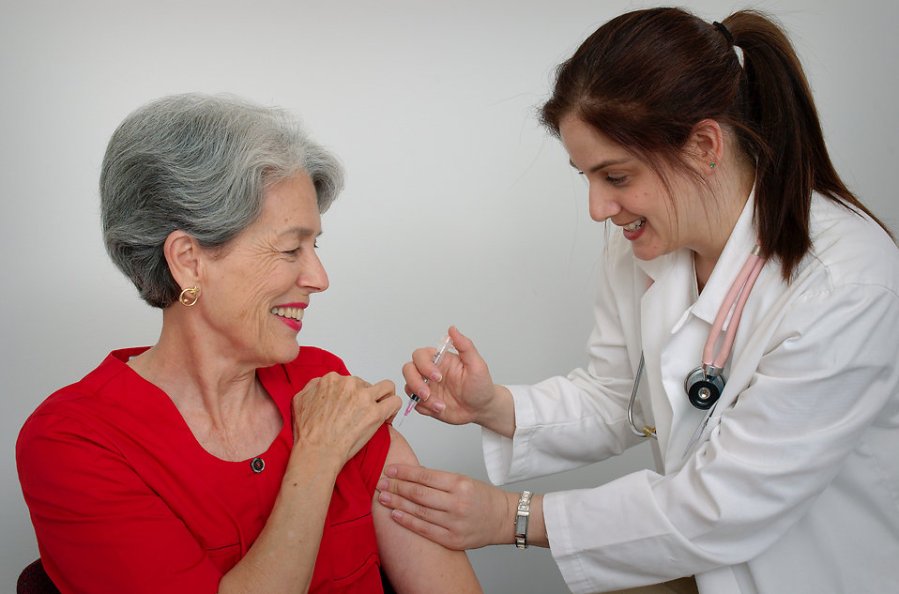 15813-a-senior-woman-receiving-a-vaccination-shot-from-her-doctor-pv